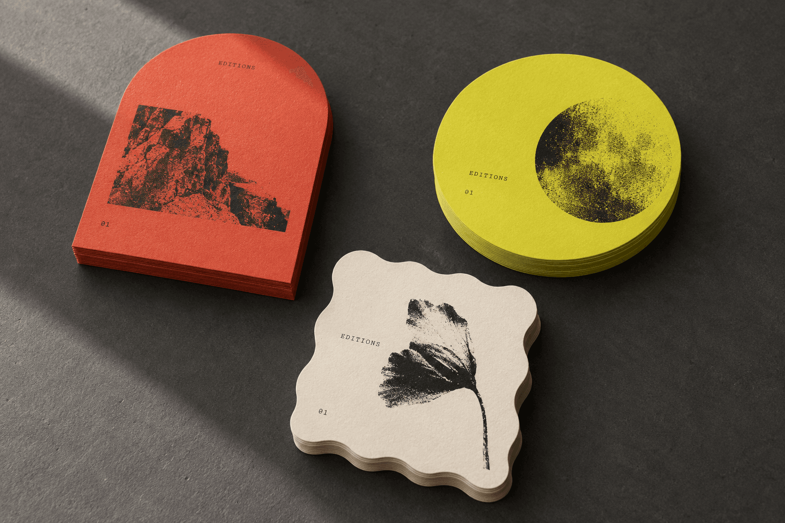 Arch, circular and wavy-edge flyers in vermilion, yellow and cream; example die-cut shapes