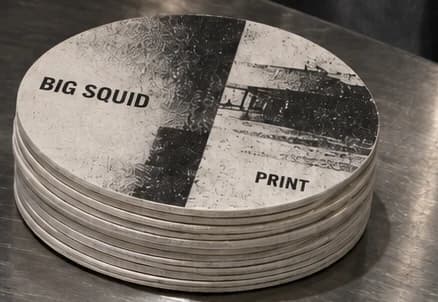 Example artwork for coasters; stock and finish follow the selected specification
